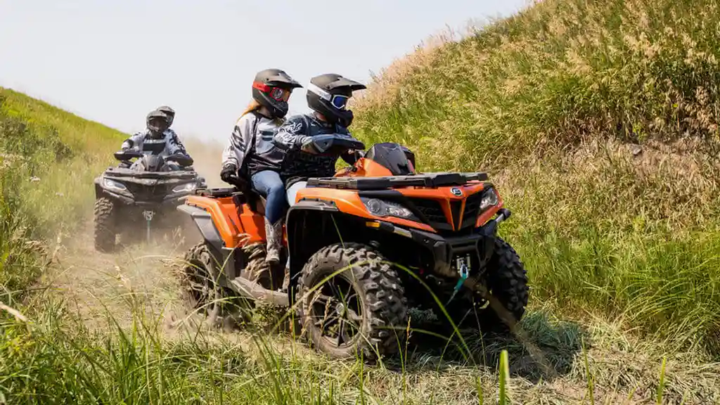 overhead view of corned beef sliced and on a platter with cabbage, potatoes, and carrots